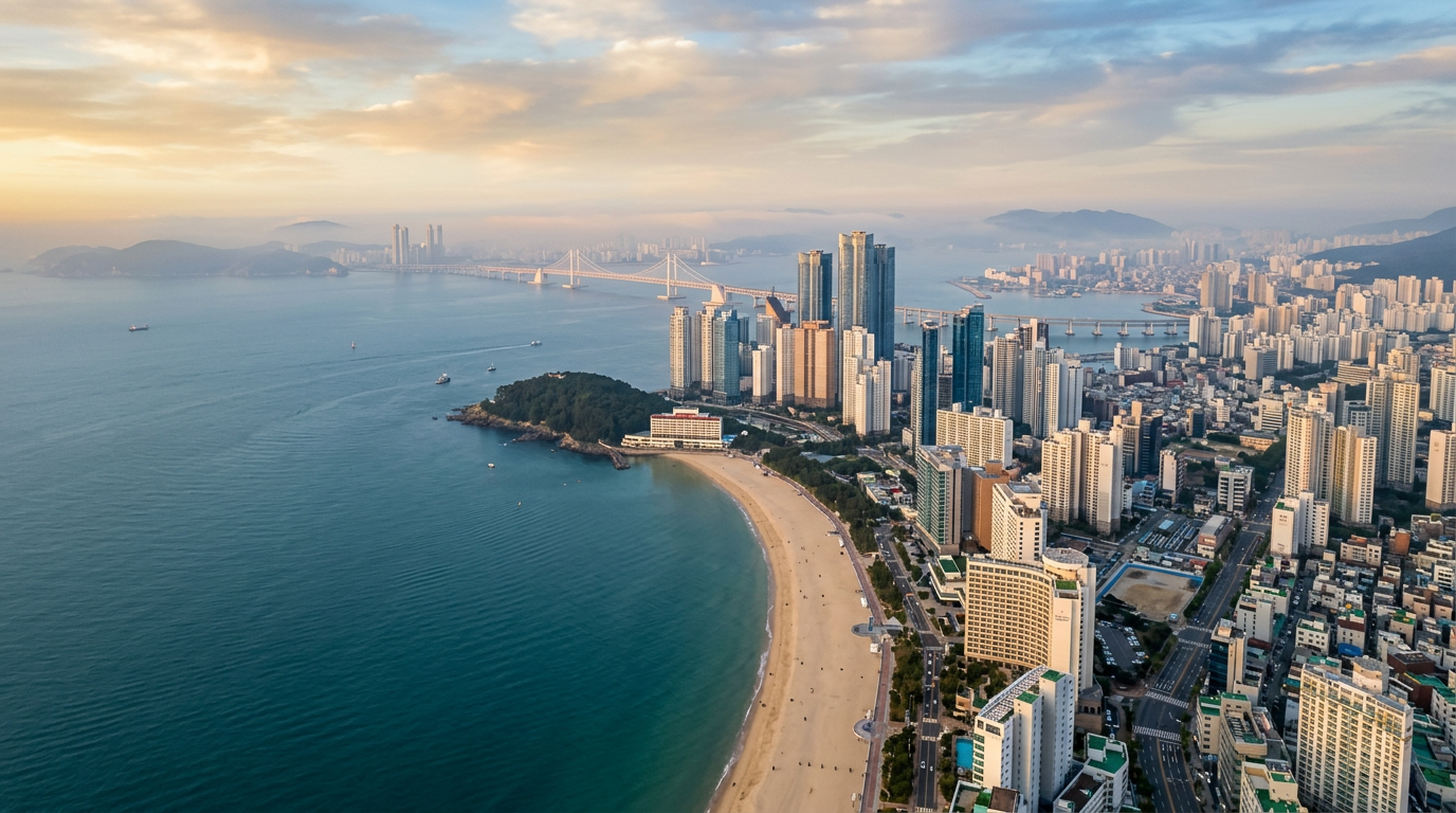 Aerial panorama of Haeundae Beach, Busan, with the coastline, sea, and high-rise skyline